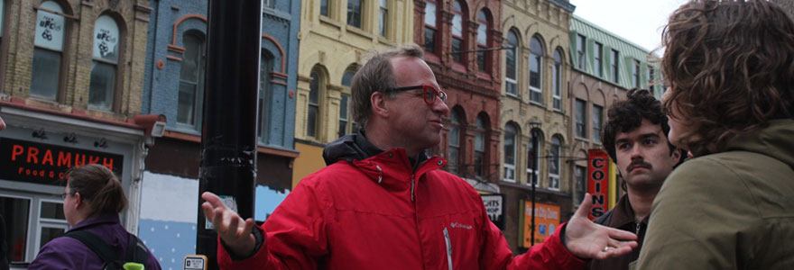 Political science professor Martin Horak speaks to his class at King and Richmond streets during a downtown field trip to examine the impact of political decisions on London's core.
