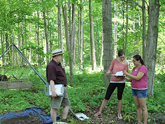 Neal Ferris, Nadine Finlay and Shauna Kechego-Nichols at anthropology field school